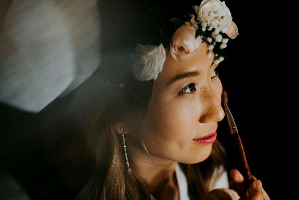 Susan Lin applying bridal makeup